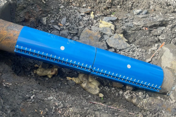 Bespoke Encapsulation Collar Two bespoke encapsulation collars installed around a large diameter pipeline within an excavated trench