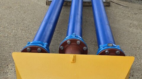 On-site System 2000 installation, showing a close-up view of a temporary access ramp installed over the pipeline with flange adaptors fitted