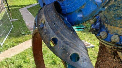 Close-up of a damaged pipeline flange and gasket prior to replacement, showing joint failure that required removal during emergency water network repair works