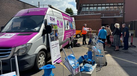 R2M roadshow van set up on site, showcasing hands-on demonstrations of pipeline products and solutions, with customers engaging directly with technical experts