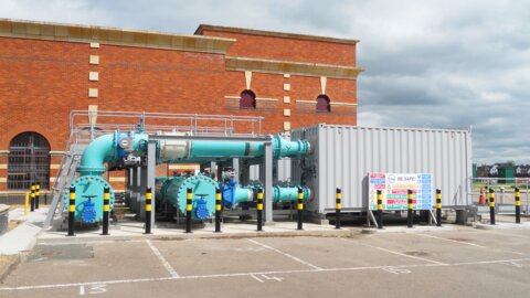 Wide view of a water treatment works showing large-diameter pipelines with butterfly valves