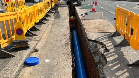 Completed Molecor MoPVC pipeline installed beneath the roadway in a narrow trench