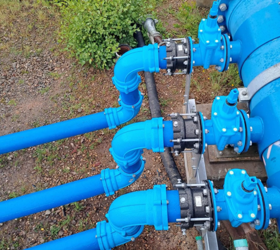 Installed System 2000 bend fittings on multiple pipelines connected to valves and couplings