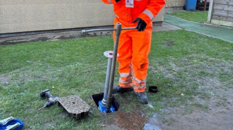 Engineer explaining the installation process of a Haldi hydrant safety clamp on a live hydrant during on-site works for a customer