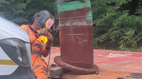 Engineer welding a bespoke ductile iron fitting prior to installation on a water network