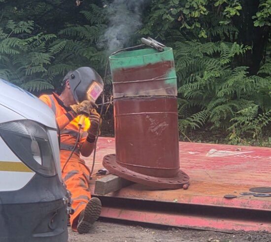 Engineer welding a bespoke ductile iron fitting prior to installation on a water network